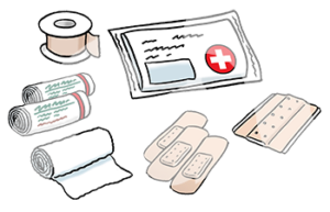 Verbandszeug, Pflaster und eine Verpackung mit weißem Kreuz auf rotem Untergrund.