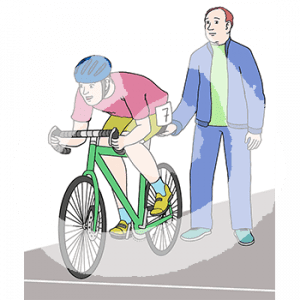 Eine Person in Sportkleidung mit Startnummer sitzt auf einem Fahrrad an einer Startlinie. Eine Person steht hinter ihr und hält den Sattel fest.