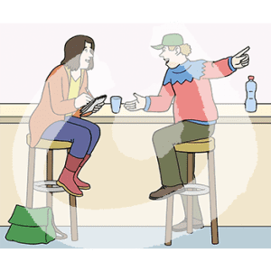 Zwei Personen sitzen an einer Theke. Eine Person zeigt auf etwas, die andere schreibt in ein Notizblock.