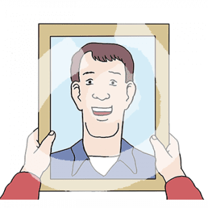 Zwei Hände halten einen Rahmen mit dem Portrait eines lächelnden Mannes fest.