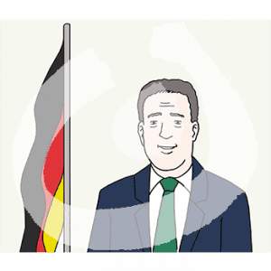 Portrait eines Mannes neben einer Deutschlandflagge.