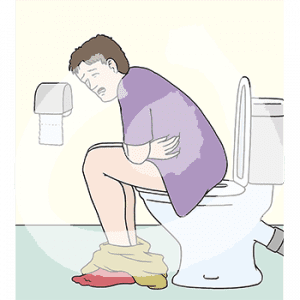 Eine Person mit schmerzverzerrtem Gesicht sitzt auf einer Toilette und hält sich den Bauch.