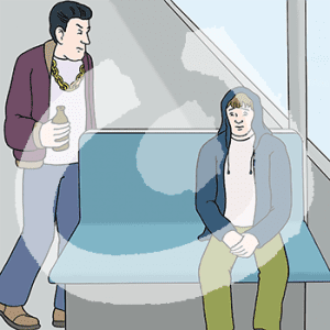 Eine ängstliche Person sitzt auf einer Bank in der Bahn. Daneben steht ein wütender Mann.