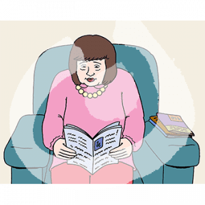 Eine Frau sitzt in einem Sessel und liest.