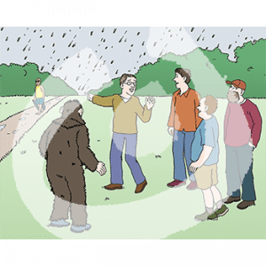 Vier Personen und eine Person in Affenkostüm stehen im Regen auf einer Wiese. Sie gucken zu einem Mann mit Koffer der auf einem Weg läuft.