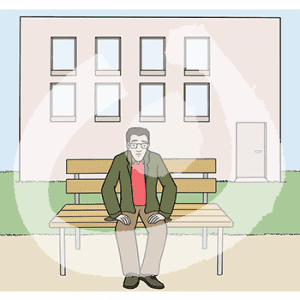 Eine Person sitzt auf einer Bank vor einem Gebäude.