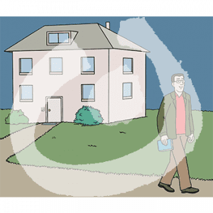 Eine Person geht von einem Haus weg.