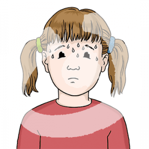 Portraitansicht eines Kindes mit Schweißtropfen auf der Stirn.