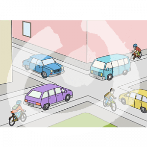 Eine Kreuzung mit Autos. Auf dem Bürgersteig fahren Fahrräder.