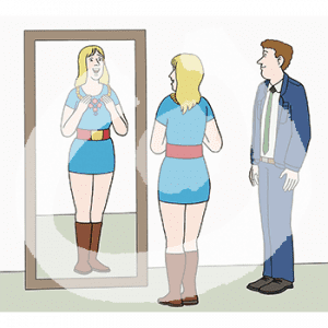 Eine fröhliche Frau fasst eine Kette an ihrem Hals an und guckt in den Spiegel. Daneben steht ein Mann.