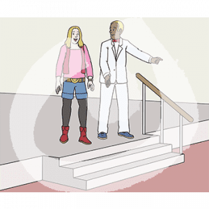 Zwei Personen stehen auf einer Bühne. Eine trägt einen weißen Anzug.