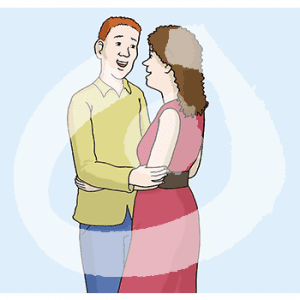 Ein Mann und eine Frau stehen Arm in Arm voreinander.