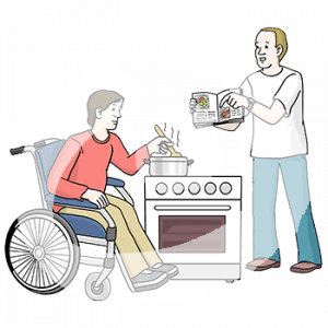 Eine Person im Rollstuhl rührt in einem Topf auf einem Herd. Davor steht eine Person und zeigt ein aufgeschlagenes Kochbuch.