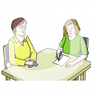 Zwei Personen sitzen an einem Tisch. Eine Person schreibt auf einem Blatt.