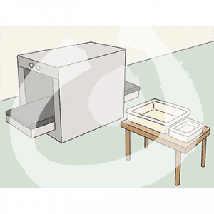 Eine Maschine mit Fließband darin. Daneben ein Tisch mit einem großen und einem kleinen Behälter.