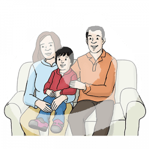 Ein Mann und eine Frau sitzen mit einem Kind auf dem Schoß auf einem Sofa.