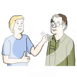 Portraitansicht einer Person die einer anderen Person auf die Schulter klopft.