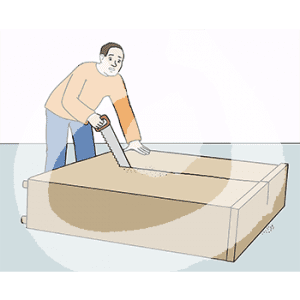 Ein Mann sägt in die Rückwand eines Schrankes.