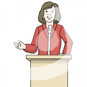 Eine Frau steht an einem Rednerpult.