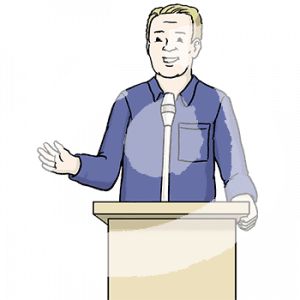 Ein Mann steht an einem Rednerpult.