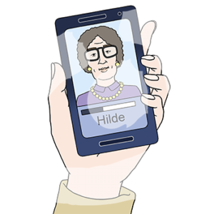 Eine Hand hält ein Handy mit dem Bild einer Frau und dem Namen: Hilde.