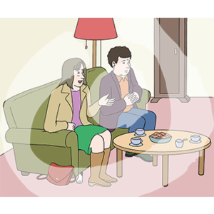 Zwei Personen sitzen auf einem Sofa. Auf dem Tisch vor sich stehen Tassen und Gebäck.