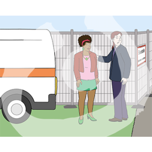 Zwei Personen stehen vor einem Bauzaun neben einem Lieferwagen.