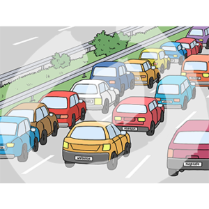 Viele Autos stehen hintereinander auf einer dreispurigen Straße.