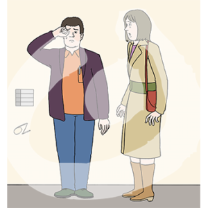 Eine Person reibt sich weinend die Augen. Eine andere Person steht erschrocken daneben.