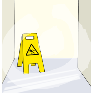 Ein Rutschgefahr-Schild steht auf einem nassen Boden.