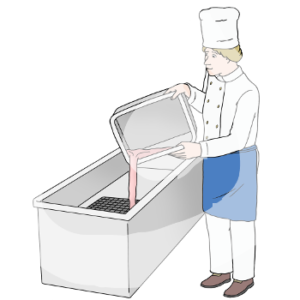 Eine Person in Kochjacke, Schürze und Kochmütze kippt eine Flüssigkeit aus einer Kiste in einen Ausguss.