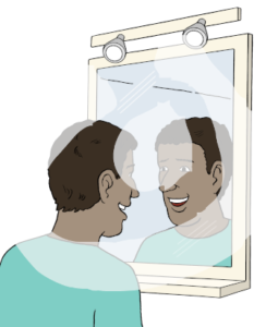 Eine fröhliche Person guckt ihr Portrait im Spiegel an.